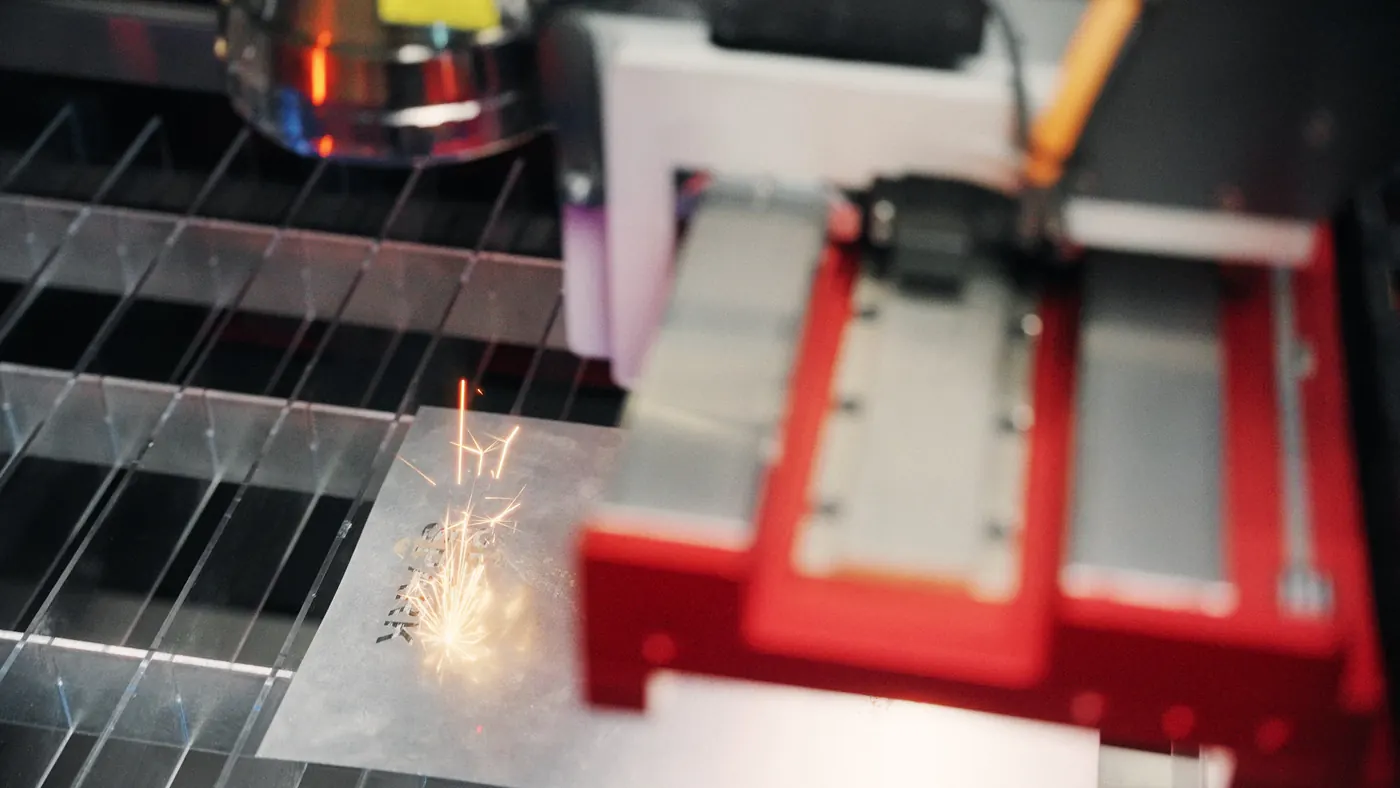Fiber laser cutting sheet metal with sparks